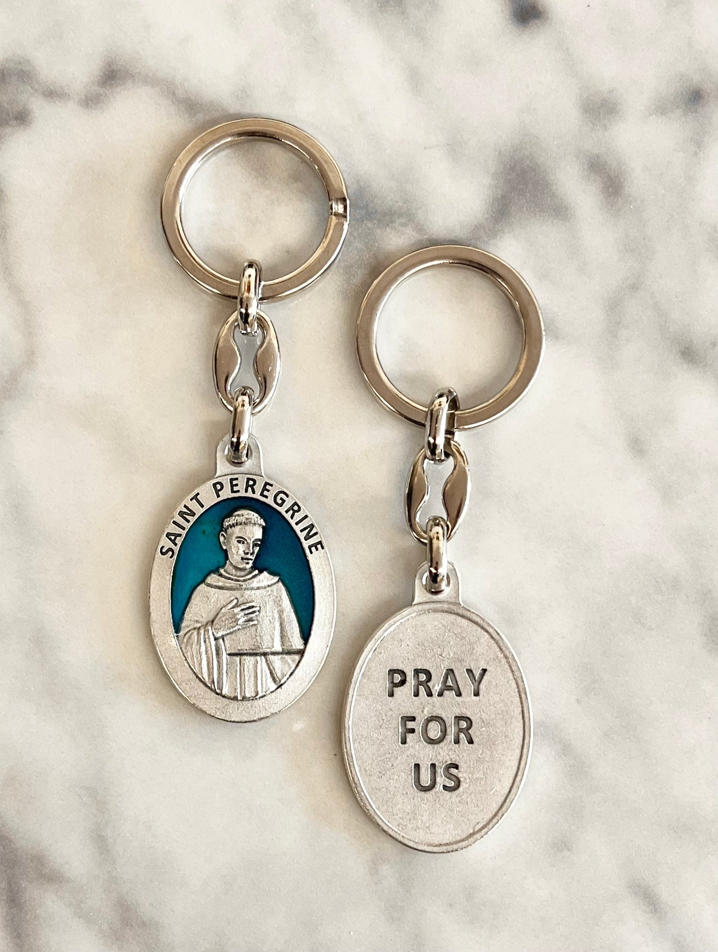 Saint Peregrine Oval Enameled Keychain with Blue Background