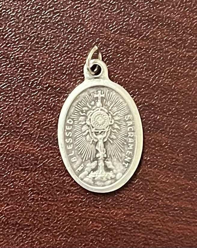 First Communion Medal – A Cherished Keepsake of the Blessed Sacrament